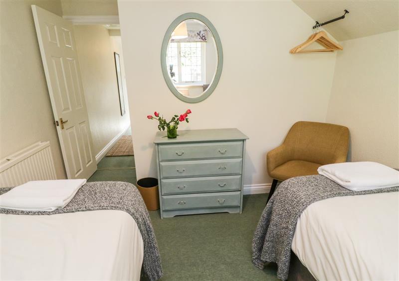 A bedroom in Pumphouse Cottage (photo 2) at Pumphouse Cottage, Uffculme