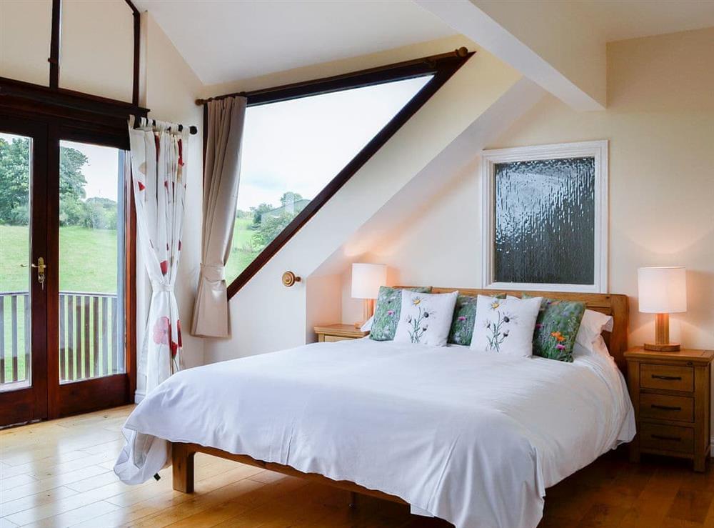 Light and airy master bedroom at Pussywillow Cottage in Rowrah, near Cockermouth, Cumbria