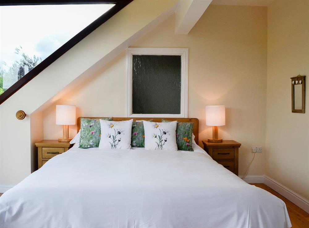 Warm and inviting double bedroom at Pussywillow Cottage in Rowrah, near Cockermouth, Cumbria