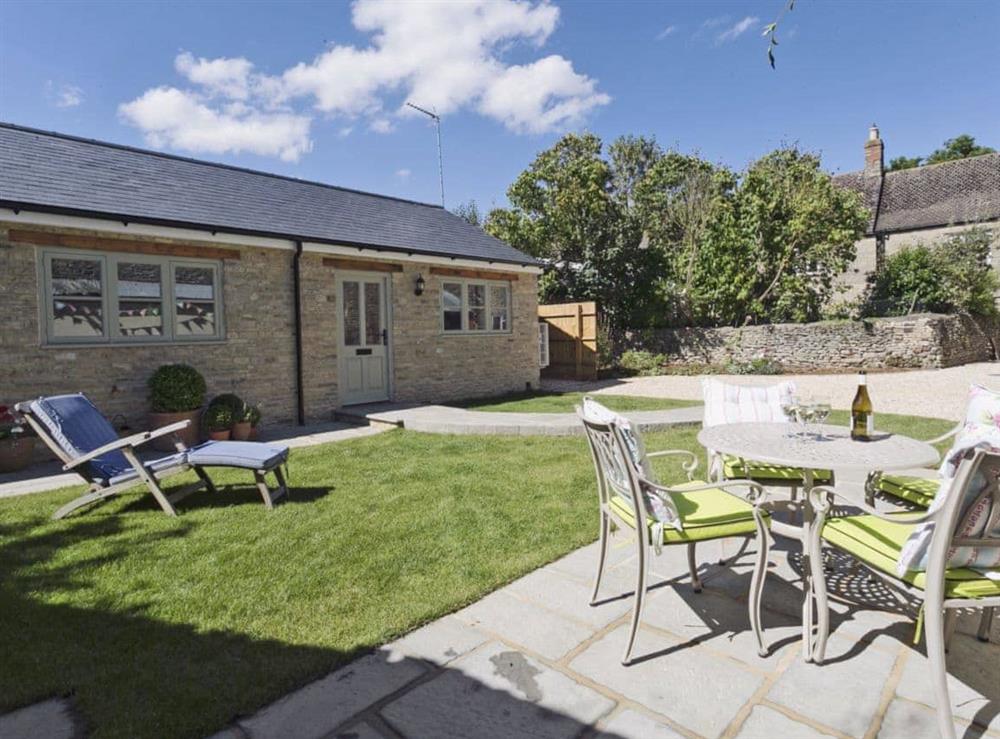 Peaceful lawned garden with terrace at Pye Cottage in Souldern, near Bicester, Oxfordshire