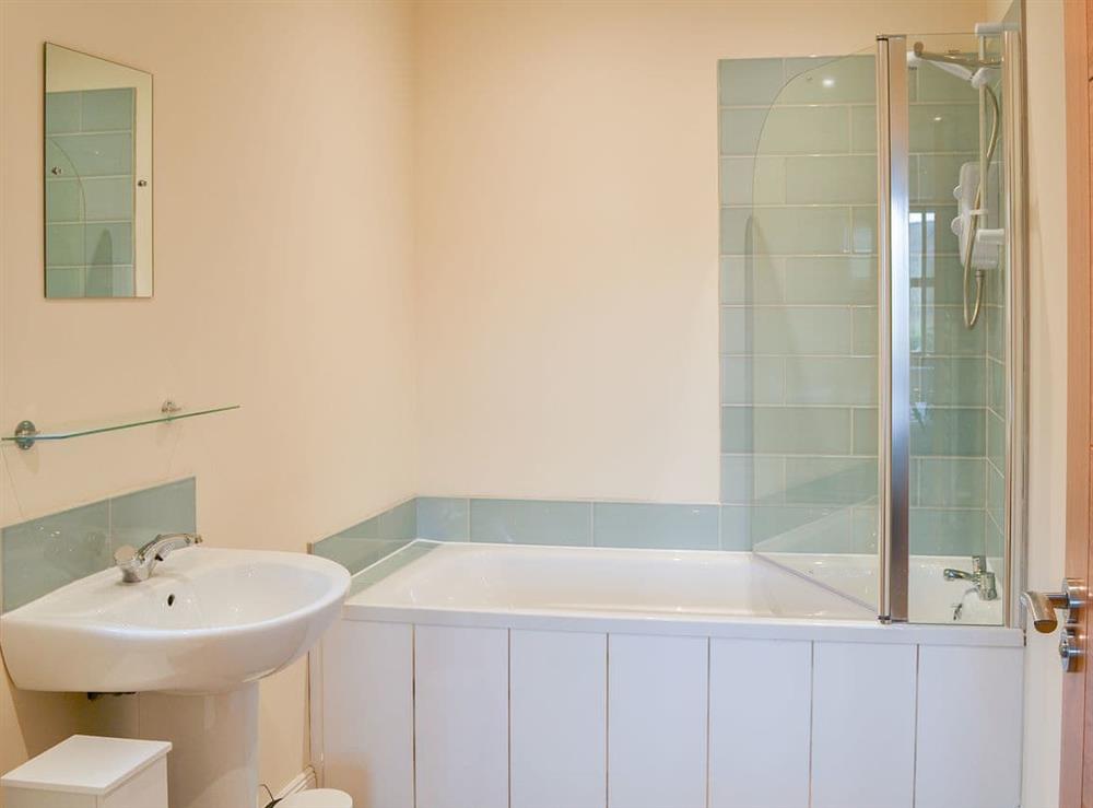 Well appointed en-suite bathroom with shower over the bath at Quails Nest in Edlingham, near Alnwick, Northumberland