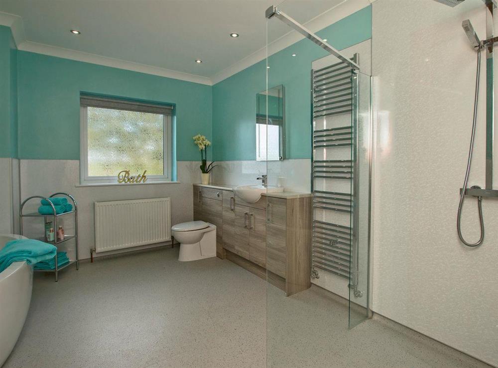 Bathroom with bath and walk-in shower at Quarter Acre House in Kirkcolm, near Stranraer, Dumfries and Galloway, Wigtownshire