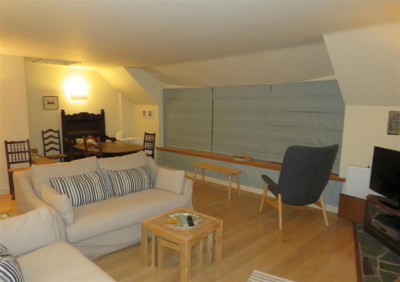 Relax in the living area at Quay Cottage, Red Wharf Bay