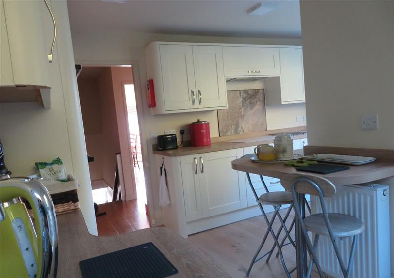 This is the kitchen (photo 2) at Quay Cottage, Red Wharf Bay