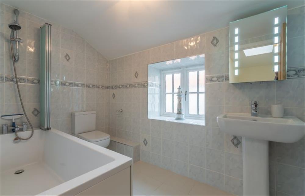 Family bathroom with shower over at Quay Cottage, Wells-next-the-Sea