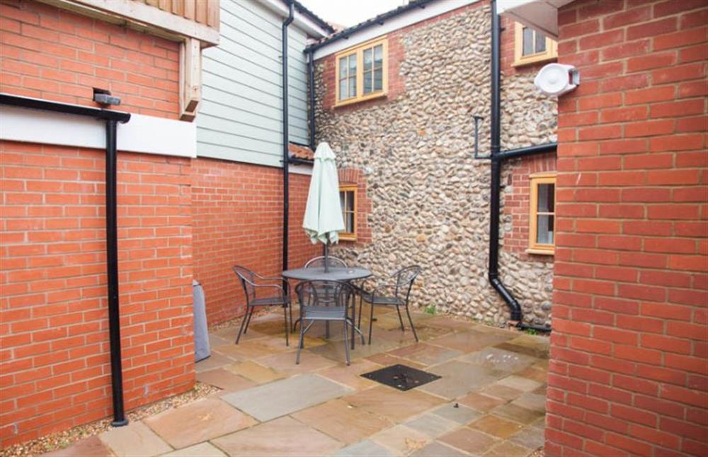 Private courtyard garden  at Quay Cottage, Wells-next-the-Sea