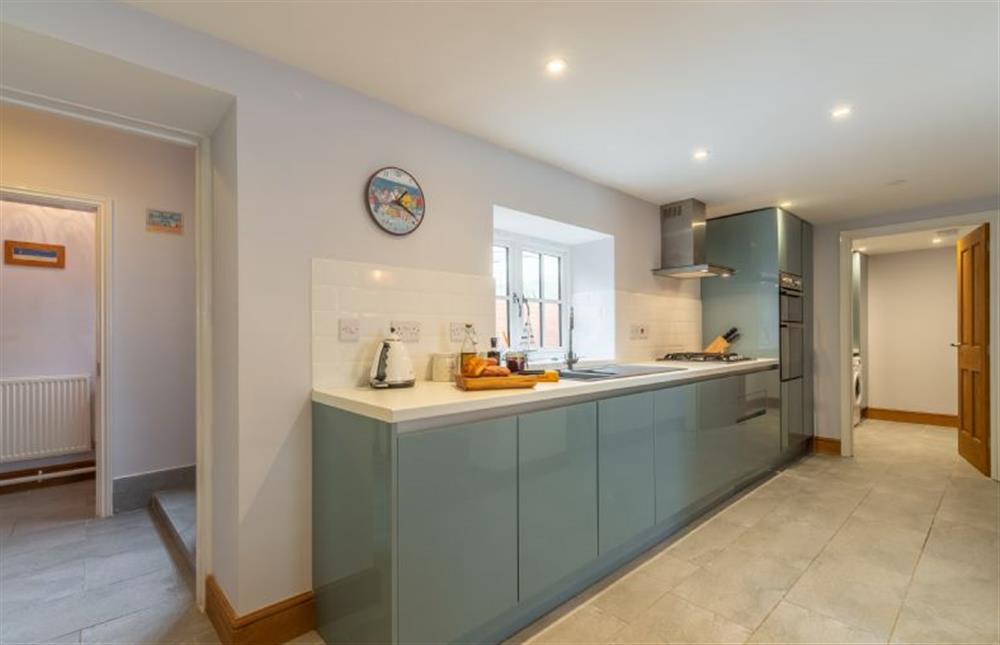 The kitchen has utility room beyond at Quay Cottage, Wells-next-the-Sea