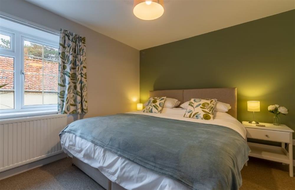 First floor: Bedroom two with super-king size zip and link bed at Quay View Cottage, Wells-next-the-Sea
