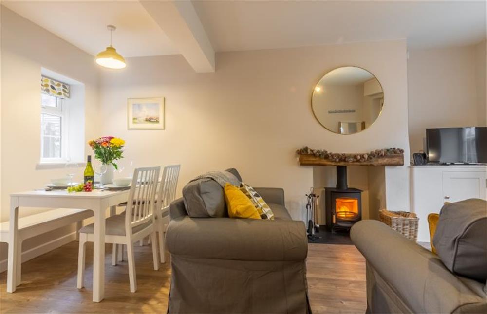 Ground floor: The dual aspect sitting/dining room  at Quay View Cottage, Wells-next-the-Sea