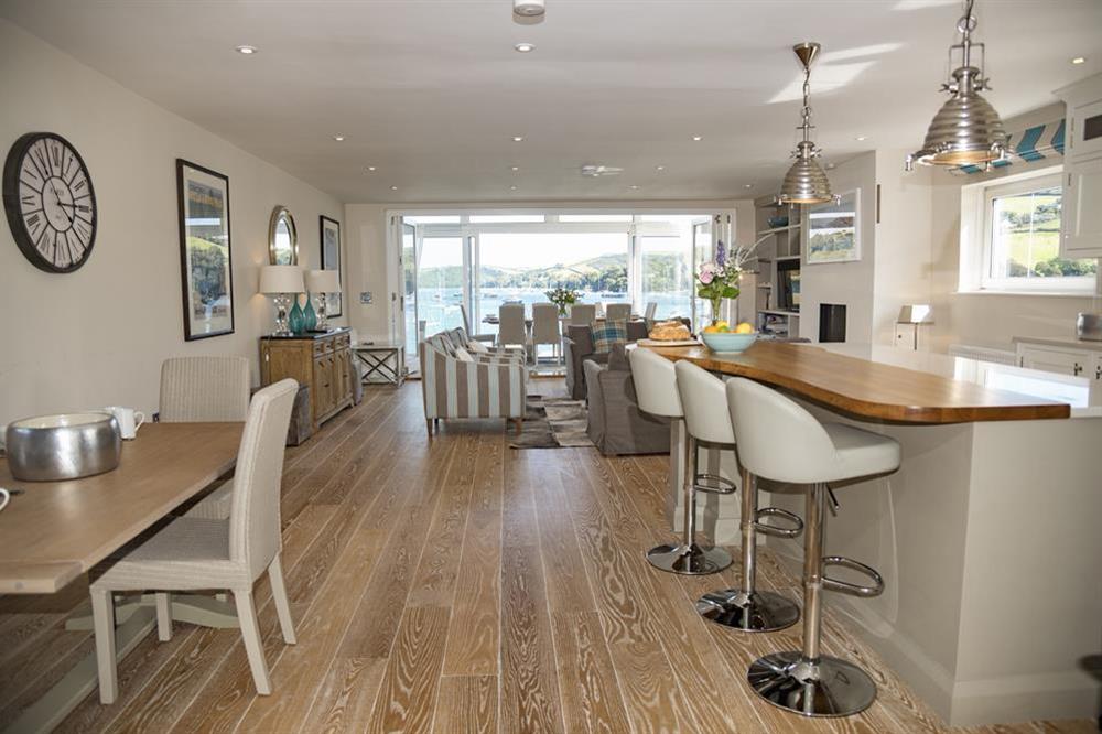 Beautifully designed kitchen with oak breakfast bar and stools at Quayside in , Salcombe