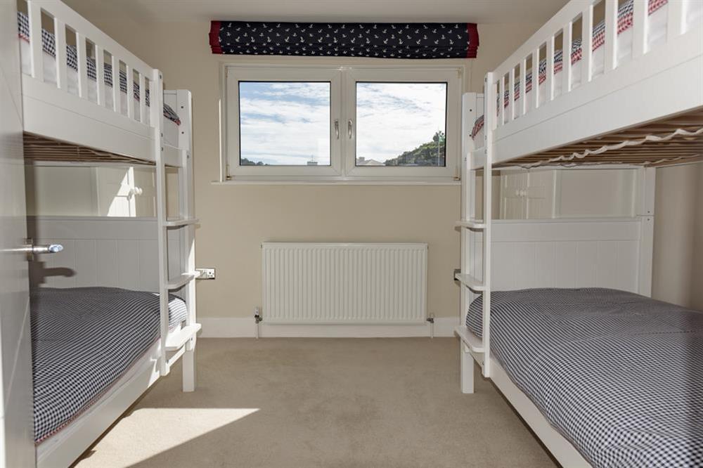 Children's bedroom with two sets of full-size bunk beds at Quayside in , Salcombe