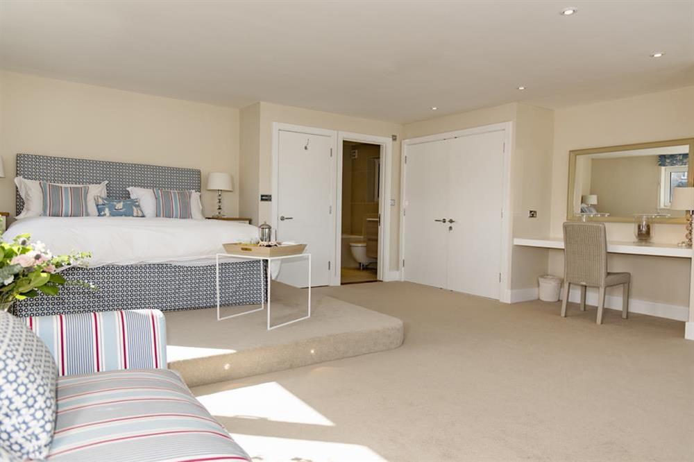Superb en suite master bedroom with wonderful views across the water from the raised super-King size bed at Quayside in , Salcombe