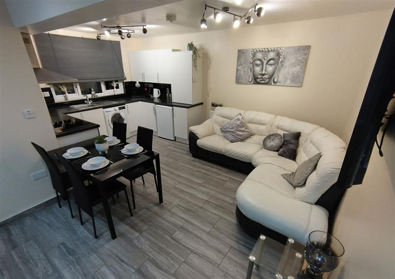 Relax in the living area at Queens Holiday Apartment, Pembroke Dock