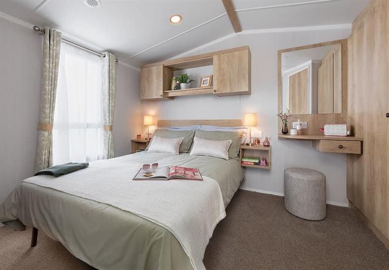 Double bedroom in the Deluxe Caravan 2 at Queensberry Bay Leisure Park in Annan, Dumfries & Galloway