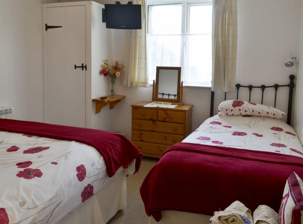 Family bedroom with double and singel beds at Barn Cottage, 