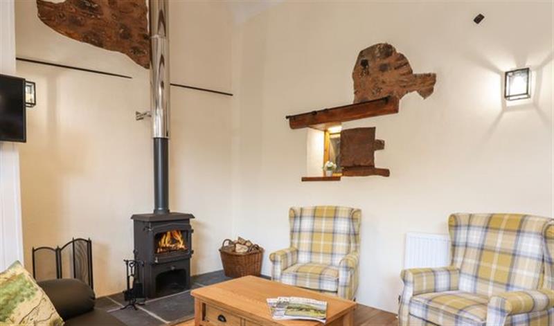 Relax in the living area at Quoit X Barn, Stoodleigh near Bampton