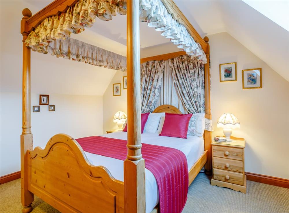 Four Poster bedroom at Rafters Barn in Runcton Holme, Norfolk