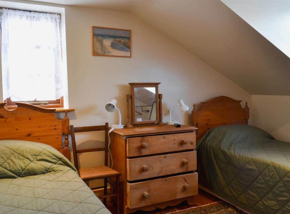 Twin bedroom at Railway Cottage in East Burton, near Wareham, Dorset