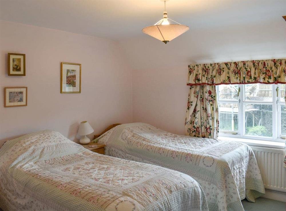 Twin bedroom at Rainbow Cottage in Bridport, Dorset