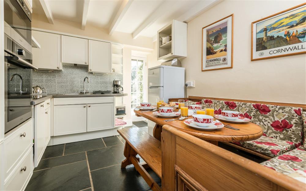 The kitchen is well equipped and has integrated appliances. at Rainbow Cottage in Porthallow