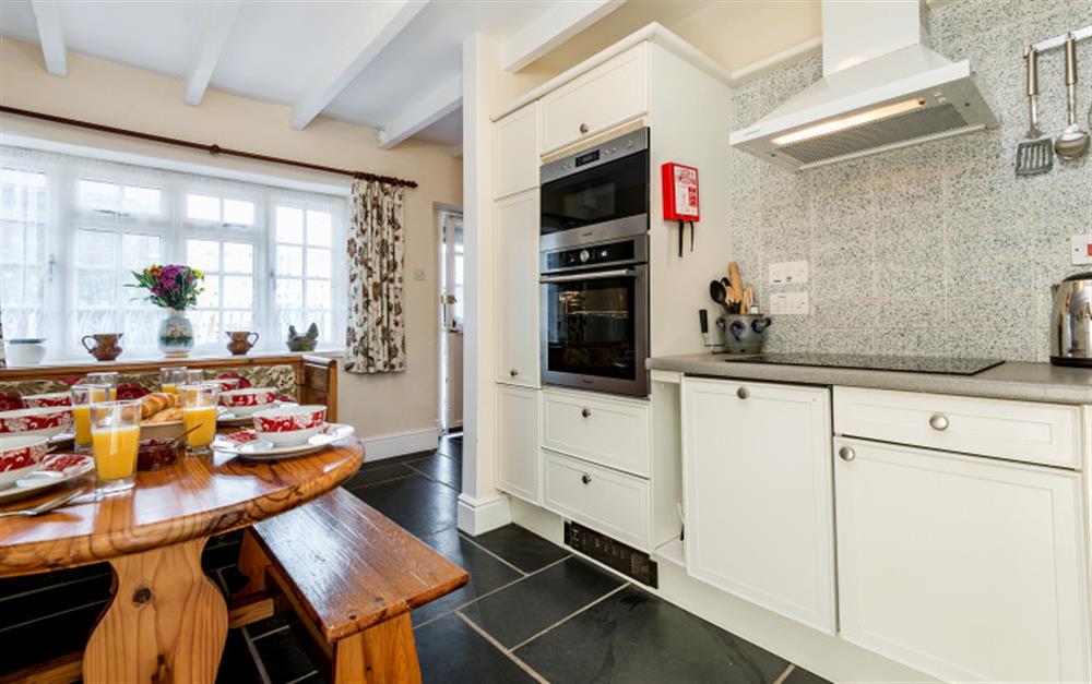 The modern kitchen look bright and fresh. at Rainbow Cottage in Porthallow