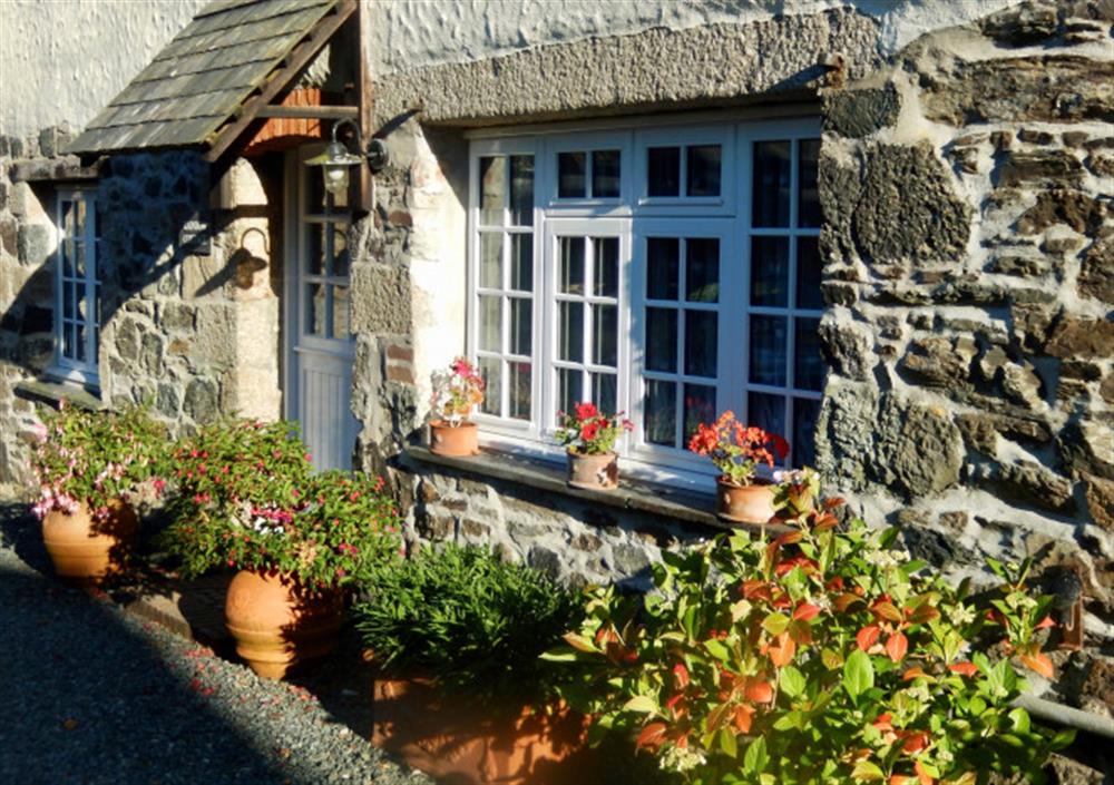 The stone cottage is rustic and charming.