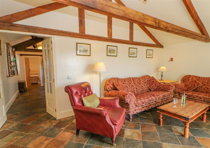 Relax in the living area at Rainbow Cottage, Soulby near Kirkby Stephen