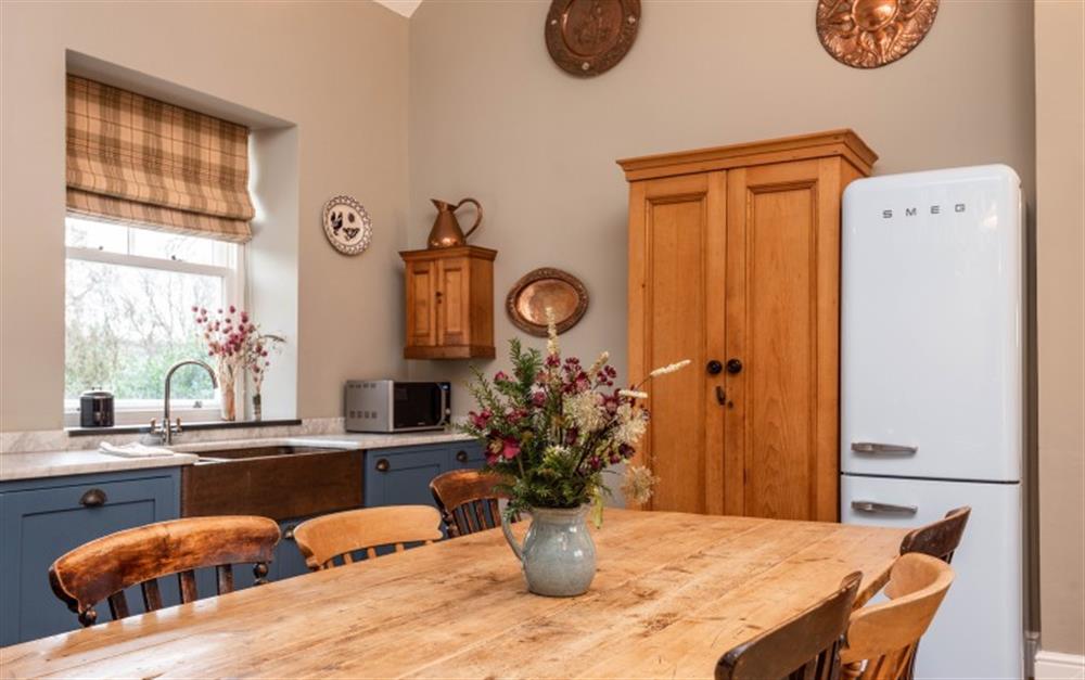Farmhouse Kitchen with seating at Raleigh Lodge in Wheddon Cross