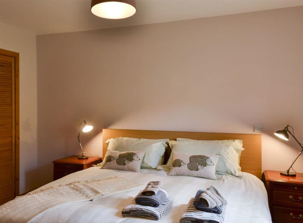 Bedroom with super kingsize bed and en-suite at Rallidae in Uig, near Portree, Isle Of Skye