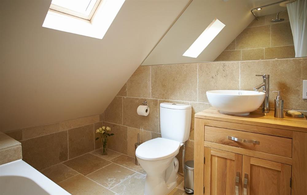 En-suite bathroom with shower over bath (photo 2) at Rampisham Hill Farm Barn, Hooke
