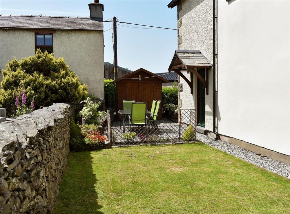 Small enclosed garden with patio, garden furniture and BBQ (photo 2) at Ramshead Cottage in Tebay, near Kendal, Cumbria