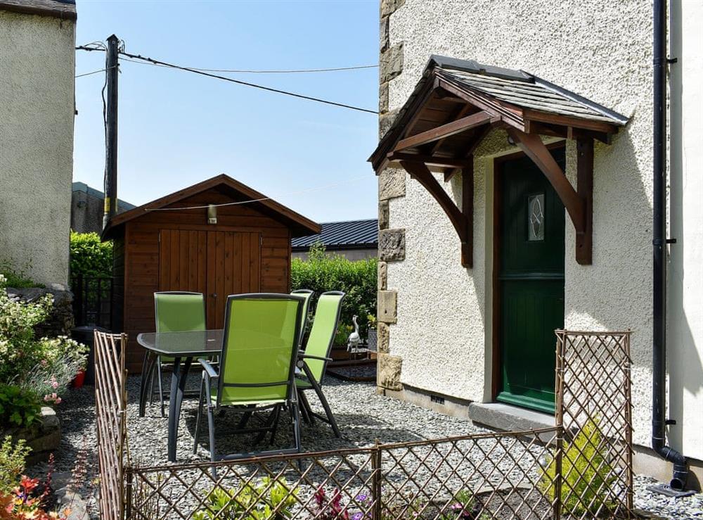 Small enclosed garden with patio, garden furniture and BBQ (photo 3) at Ramshead Cottage in Tebay, near Kendal, Cumbria