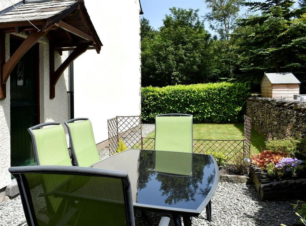 Small enclosed garden with patio, garden furniture and BBQ at Ramshead Cottage in Tebay, near Kendal, Cumbria