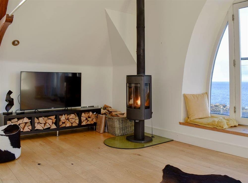Cosy wood burner in the living area at Rathven Parish Church Hall in Portessie, near Buckie, Moray, Banffshire