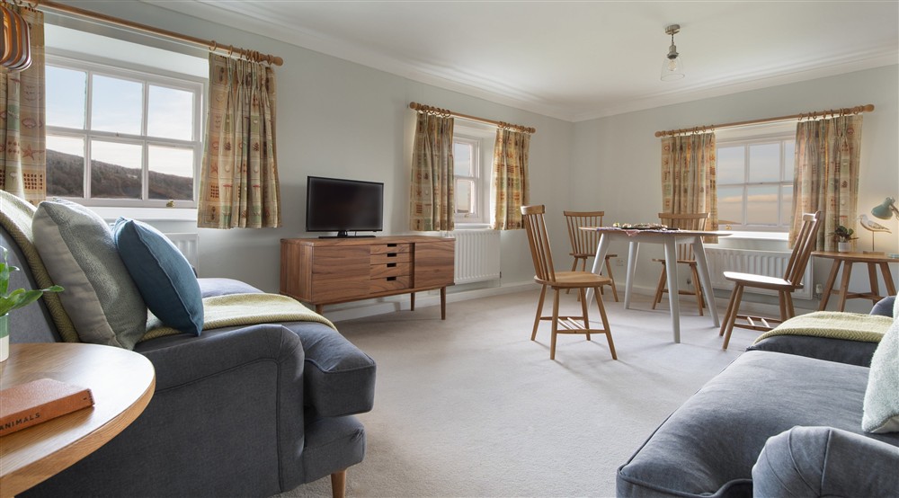 The open-plan sitting and dining room at Ravenscar Chapel Cottage in Scarborough, North Yorkshire