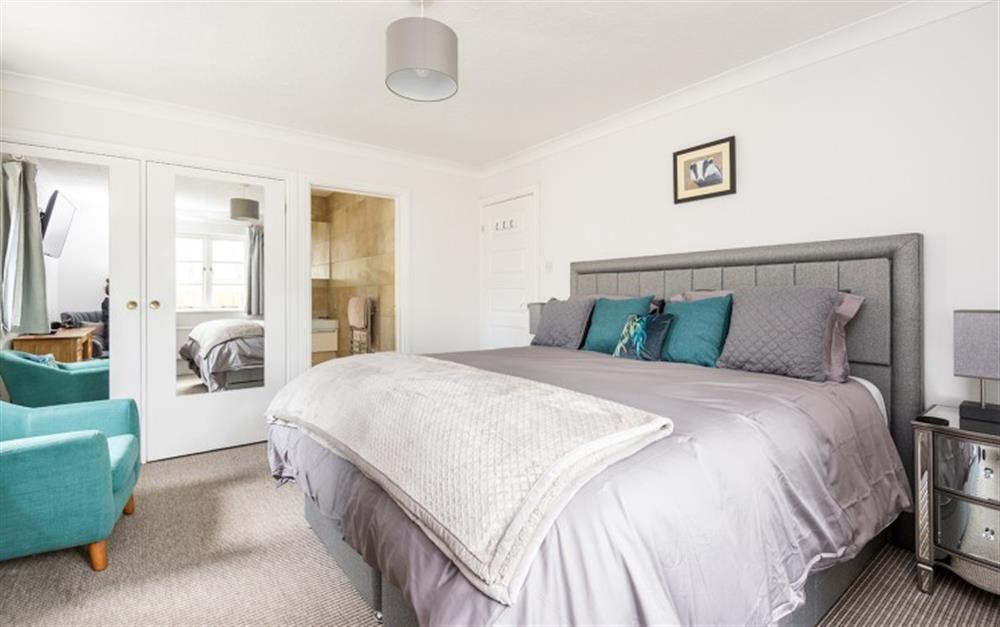 Spacious master bedroom with smart TV and super king size bed. at Rayland House in Haytor