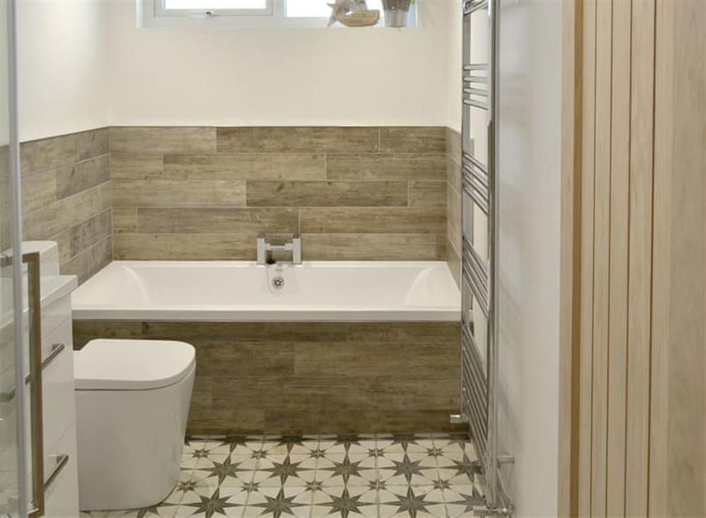 Family bathroom with bath and separate shower cubicle at Rayrigg in Bowness-on-Windermere, Cumbria