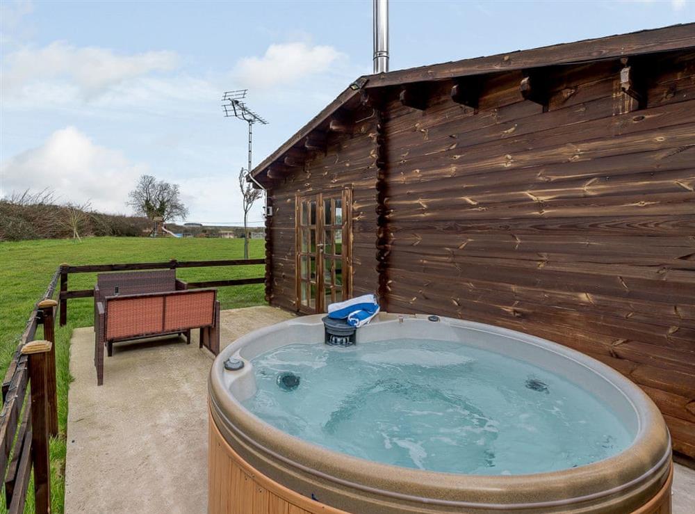 Relax and take in the view from the private hot tub at Halfmoon Wood, 