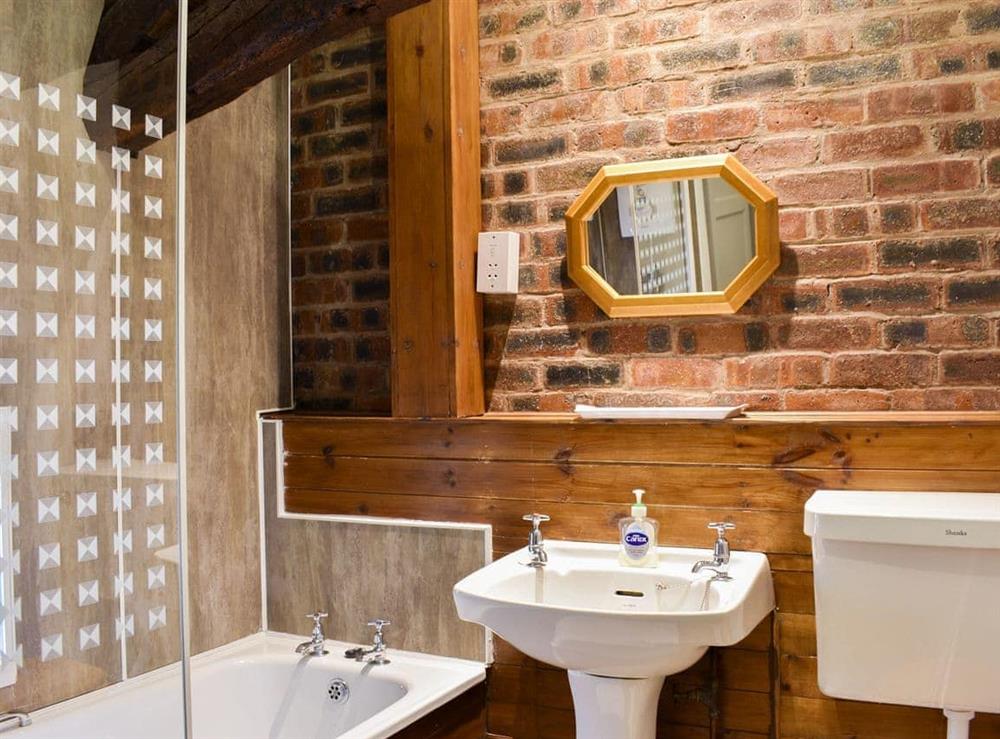 Bathroom with shower over bath at Rebeccas Cottage in Bassenthwaite, Cumbria