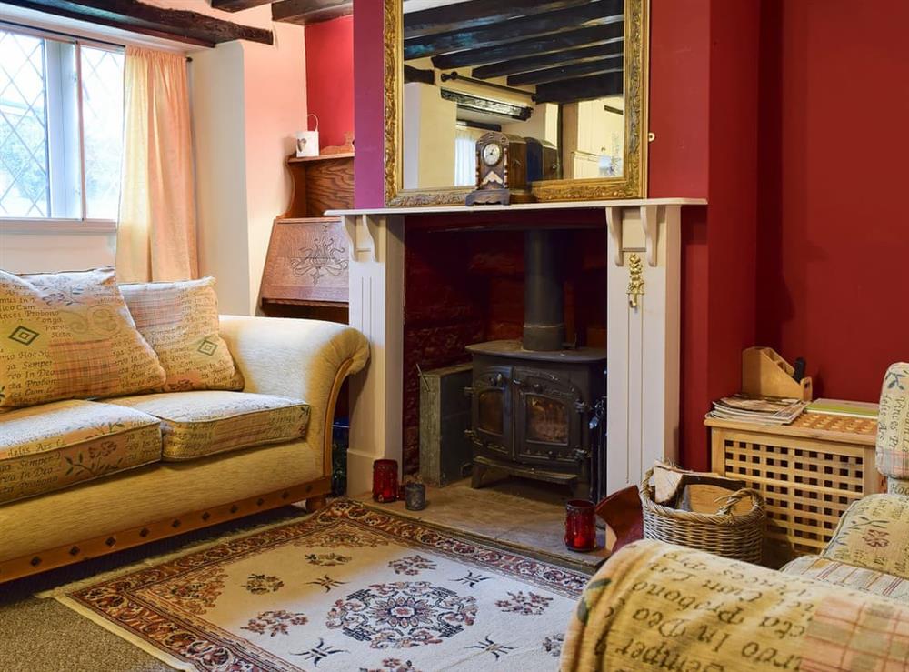 Cosy living/dining room with wood burner at Rebeccas Cottage in Welton, Nottinghamshire