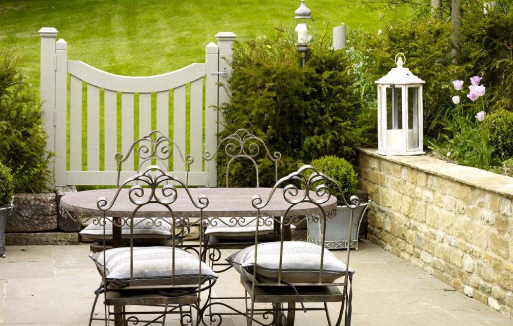 Dine al fresco in the courtyard garden  at Rectory Cottage, Tinwell