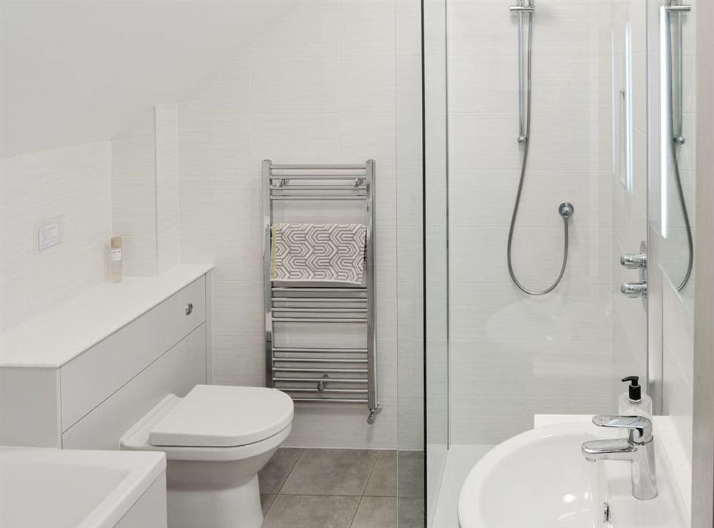 Family bathroom with bath and separate shower cubicle at Red Barn Cottage in Kettleburgh, near Framlingham, Suffolk