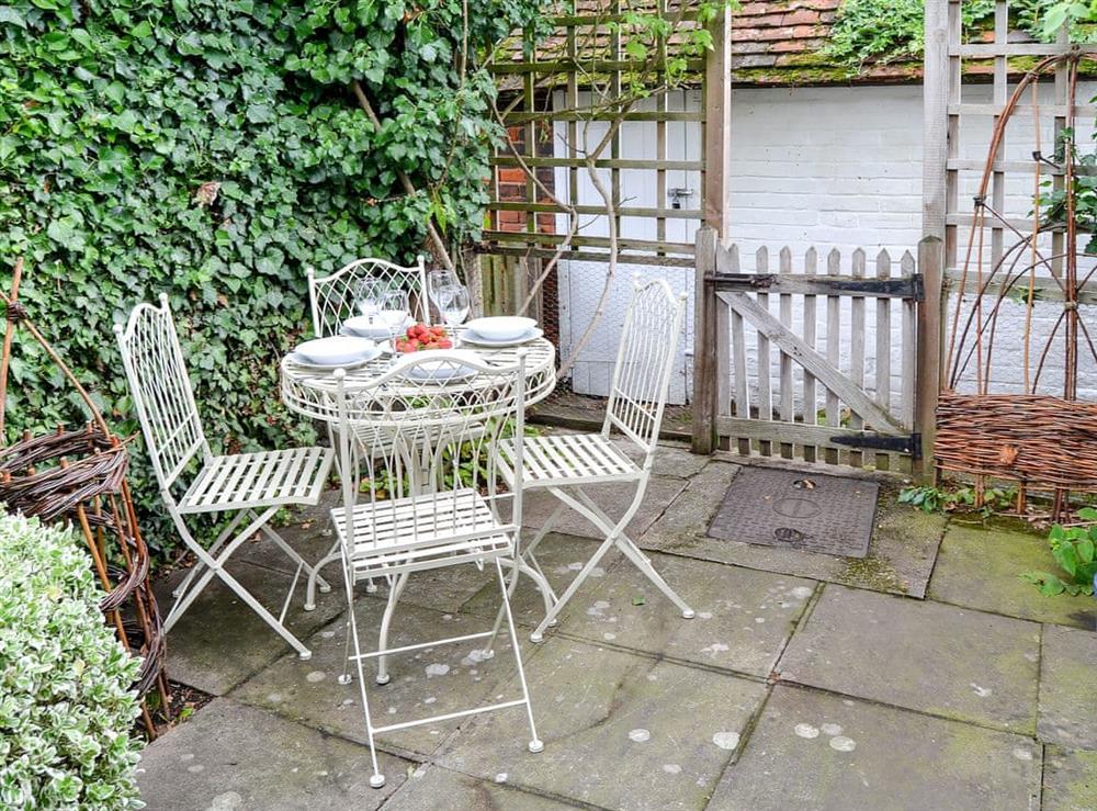 Enjoy an alfresco meal in the private garden at Red Brick Cottage in Lavenham, Suffolk