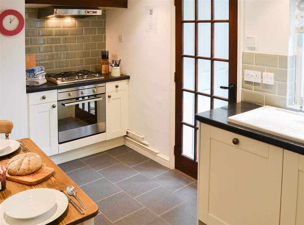 Lovely kitchen with access to the garden at Red Brick Cottage in Lavenham, Suffolk