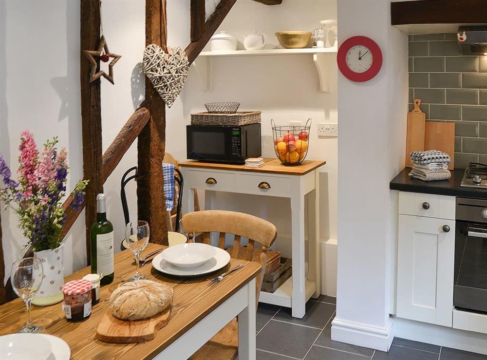 Modest dining area in well appointed kitchen at Red Brick Cottage in Lavenham, Suffolk