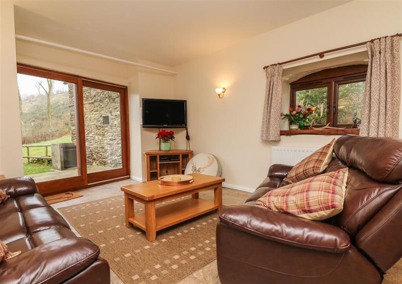 Relax in the living area at Red Deer Cottage, Wheddon Cross