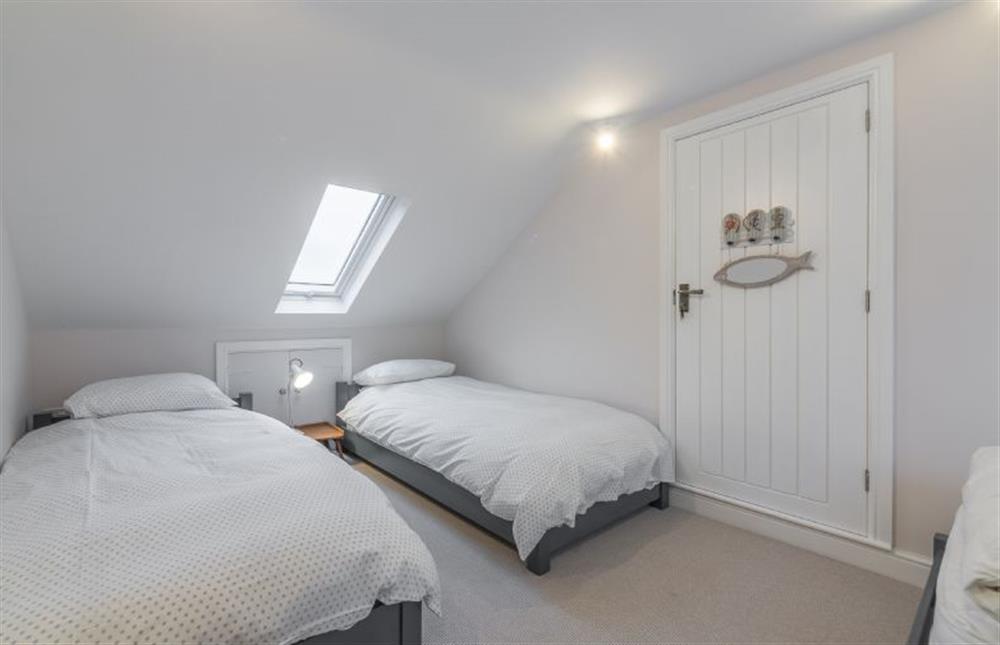 First floor: Loft room with three low-level full size single beds at Red Gables, Burnham Market near Kings Lynn