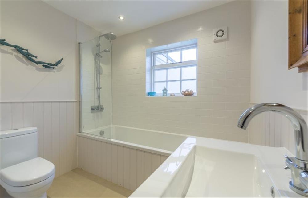 Ground floor: Family bathroom, bath with shower over at Red Gables, Burnham Market near Kings Lynn