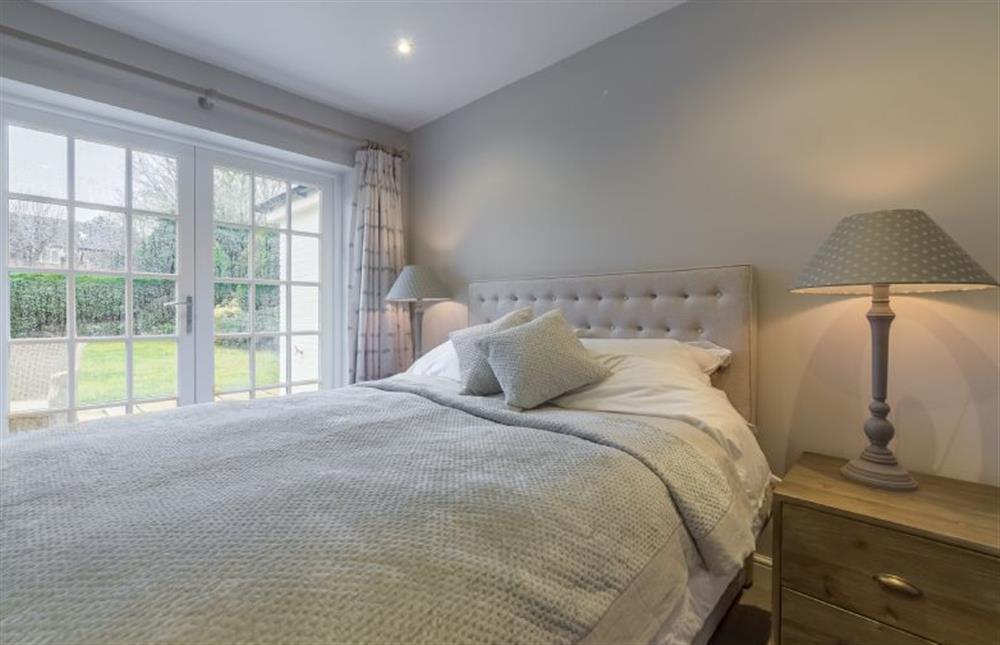 Ground floor: Master bedroom with french doors into the garden at Red Gables, Burnham Market near Kings Lynn