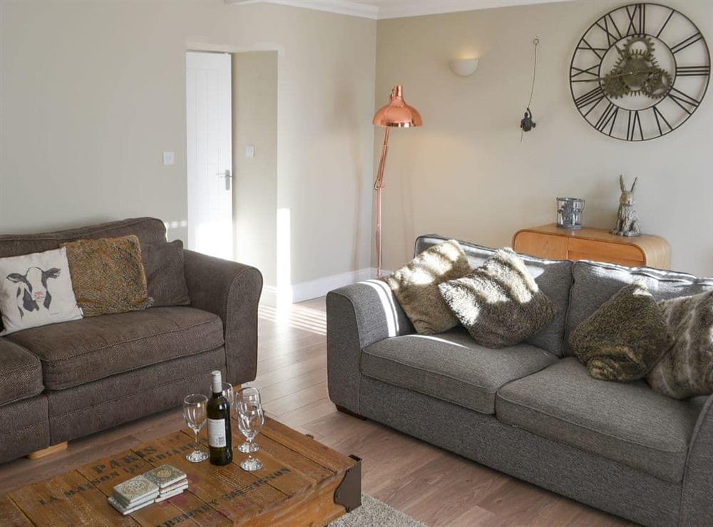 Comfortable living room with lovely sofas at Red Hen Cottage in Acklington, Northumberland